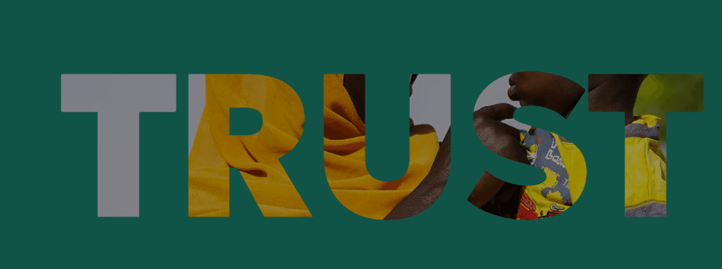 Word 'TRUST' in large letters with photographs of African people and textiles layered within the letterforms